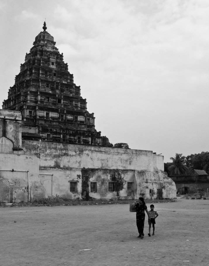 A mother and son walking behind the Tanjore old palace. Tanjore, Tamil Nadu, India