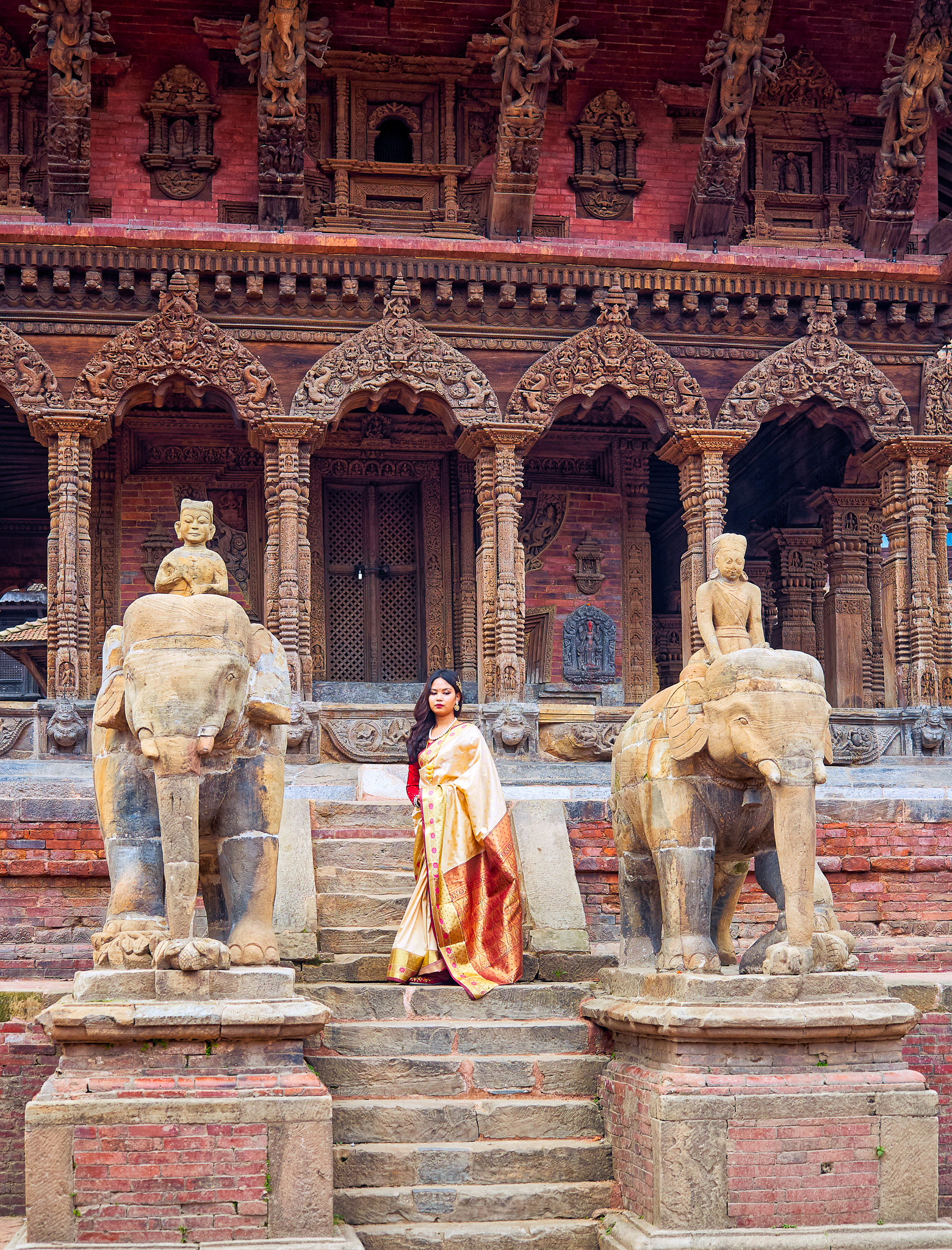 A woman having a photo shoot at Patan Durbar Square, Kathmandu, Nepal