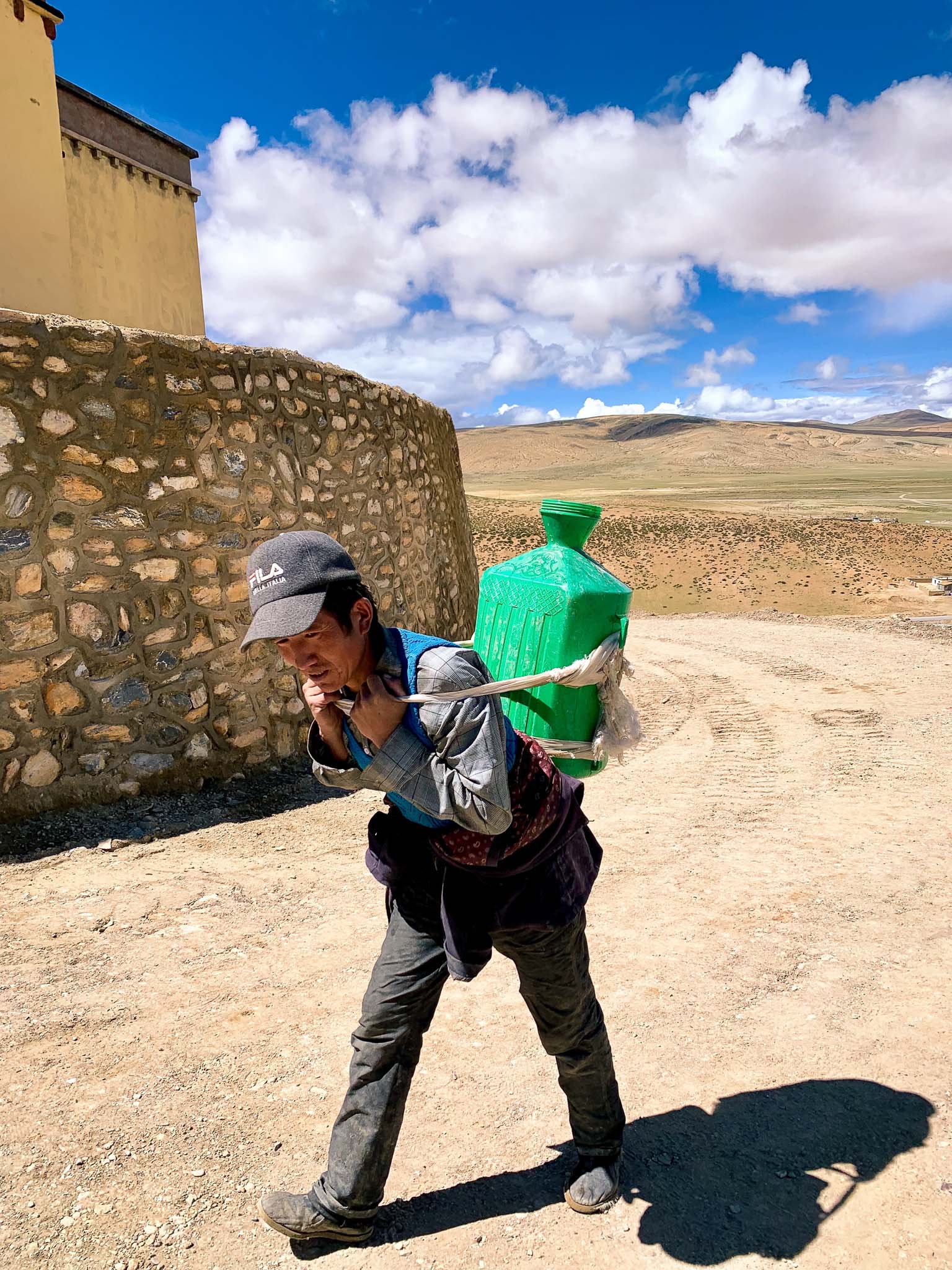 A man fetching water to the Chiu Monastery near Manasarovar lake, Tibet
